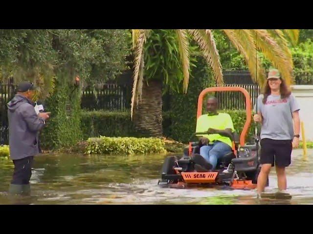 ‘That’s America!’ Florida man catches fish in middle of flooded road after Milton passes through