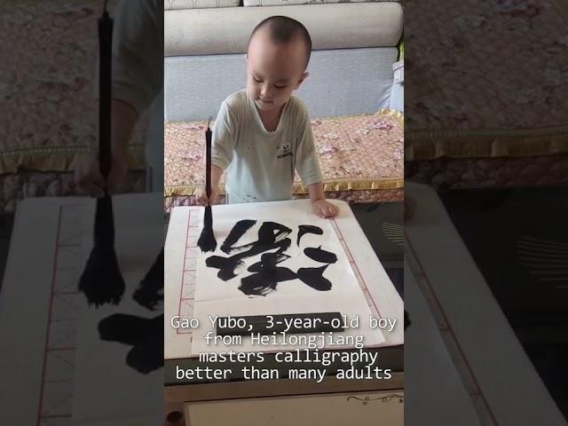 This three-year-old kid shows skills with ink brush