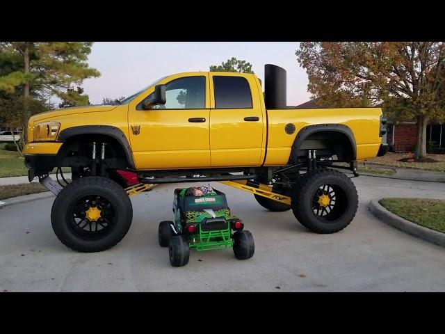 Power wheels Monster Truck Driving Under A Lifted Truck