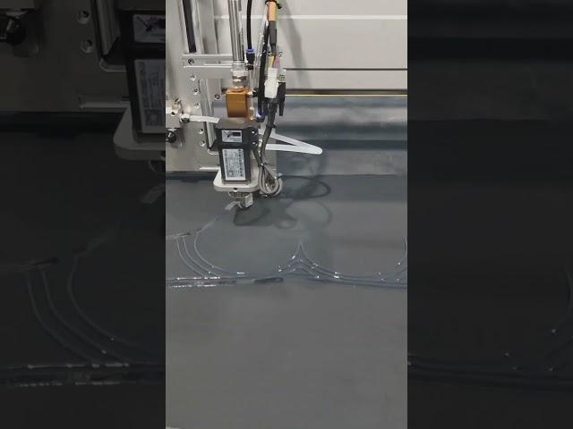 This fully automatic machine is applying glue.