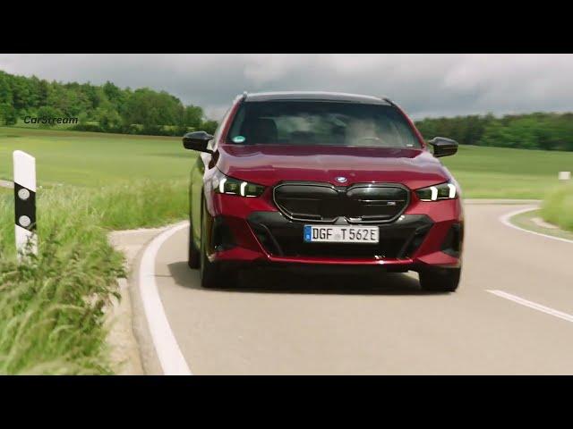 BMW i5 M60 xDrive Touring 2024 on the road