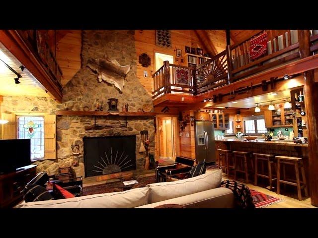 Unique log home on 11+ private acres