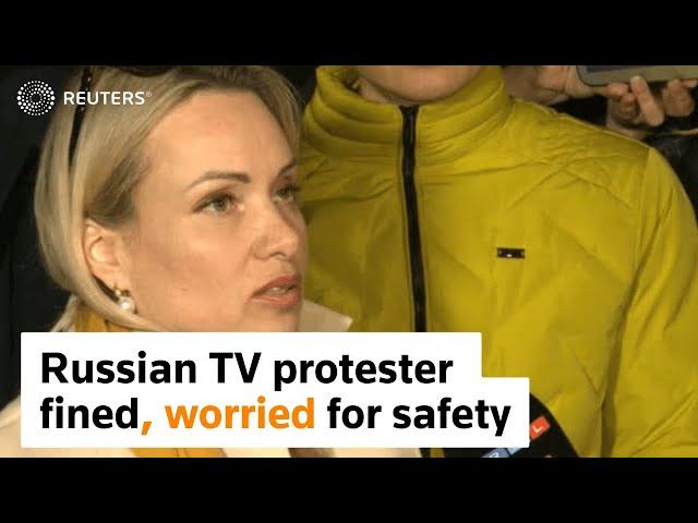 Russian TV protester fined, worried for safety