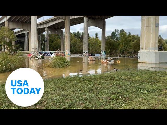 Debris, flooding fills Asheville's River Arts District after Helene | USA TODAY