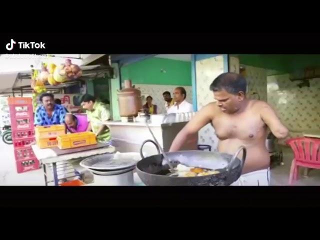 man cooking food with one hand