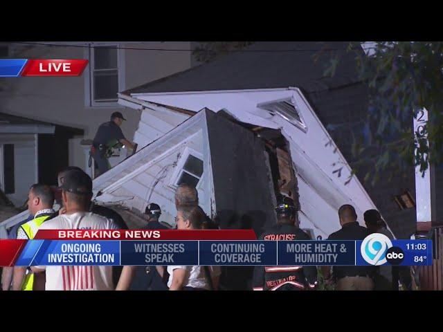 Crews working late at the site of a house collapse on Carbon Street in Syracuse