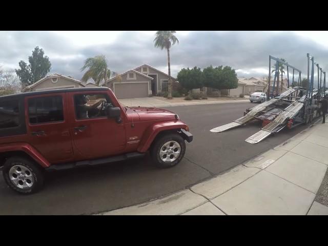 Car's  being loaded on transport for our move to Florida from Arizona