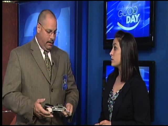 Colonel Owens demonstrates a gun lock