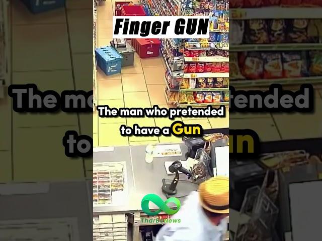 A man using his two fingers as a GUN!