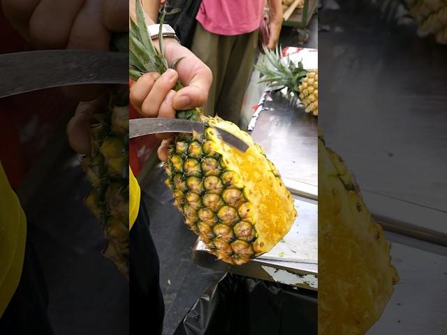 A master's dazzling pineapple cutting skills dripping with juice