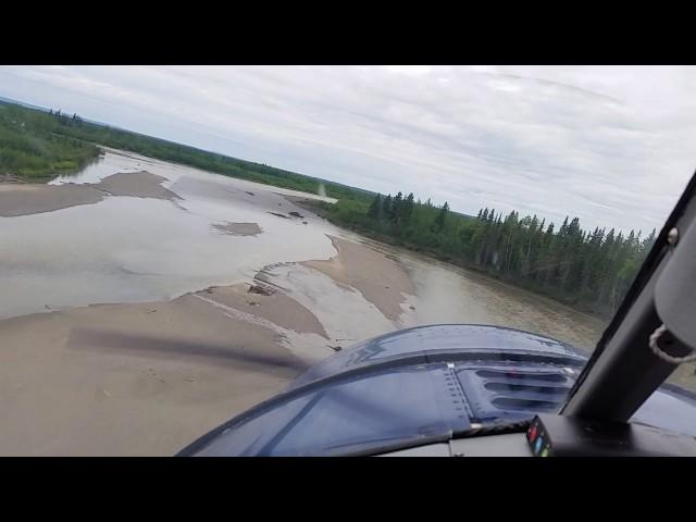 DeHavilland Beaver landing on short gravel bar in Alaska.