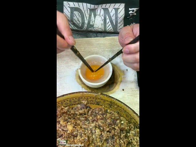 Eating ”Dandan Man Guan” in Gulangyu  Xiamen  Fujian. It costs 18 yuan per piece. The egg yolk is f