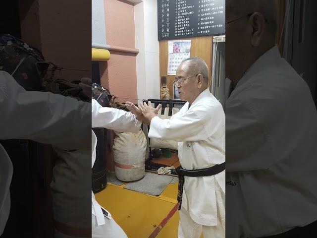 two handed defense against a strong man's attack method of Sensei Takehiro Gaja Uechi ryu Karate