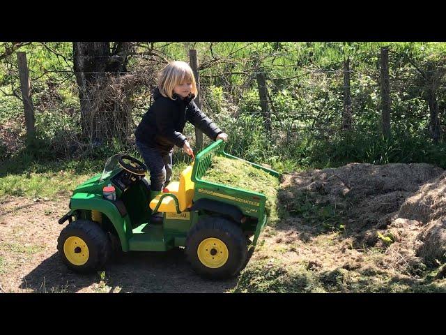 John Deere Peg Perego ride on gator for kids - great fun and a handy toy for gardening chores