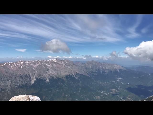 Time-lapse of clouds traveling over mountains