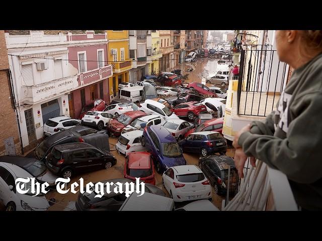 Spain flash floods: Dozens dead as cars pile up in Valencia