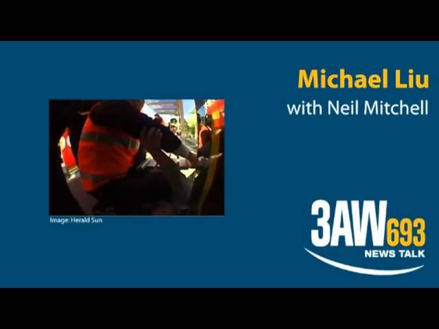 Michael Liu with Neil Mitchell