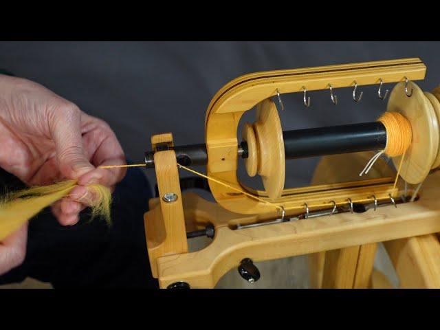 Learn how to spin on a spinning wheel.