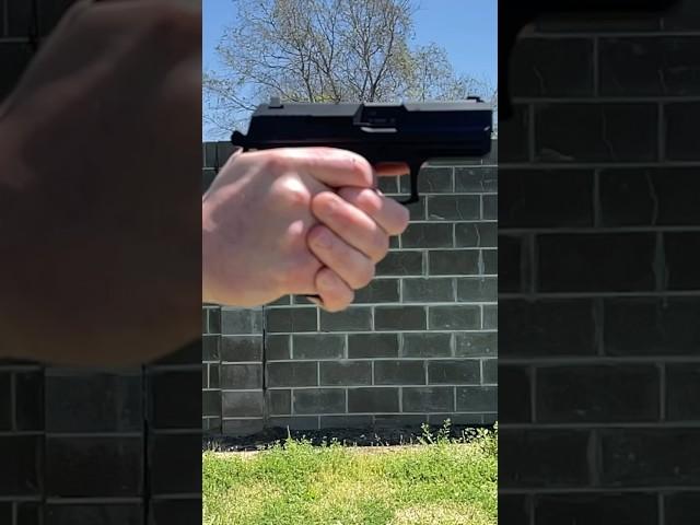 Slow Motion Heckler & Koch USP Compact 9mm Pistol- watch that big slide roll.