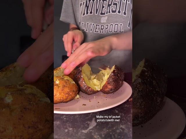 Woman is plating up a jacket potato with beans and cheese!