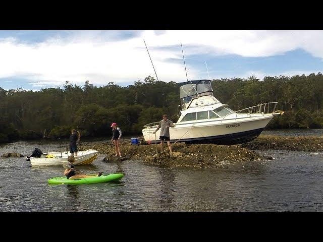 Boat (Bertram) Stuck On Rocks High & Dry Batemans Bay Australia