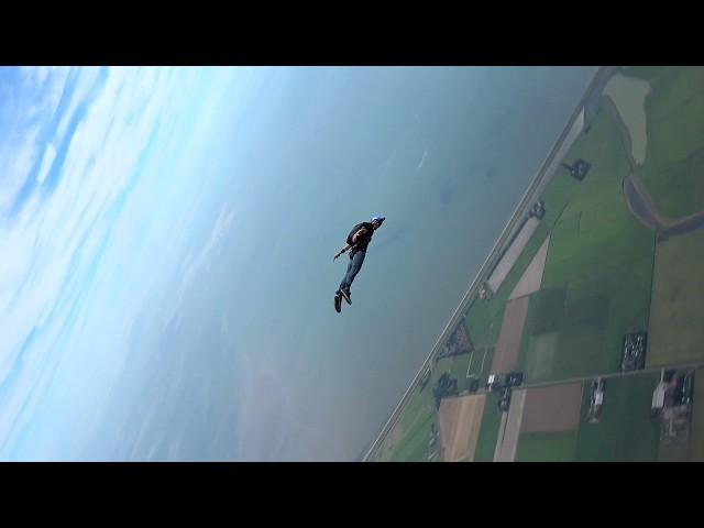 Slow-mo fliptwist before pulling his parachute