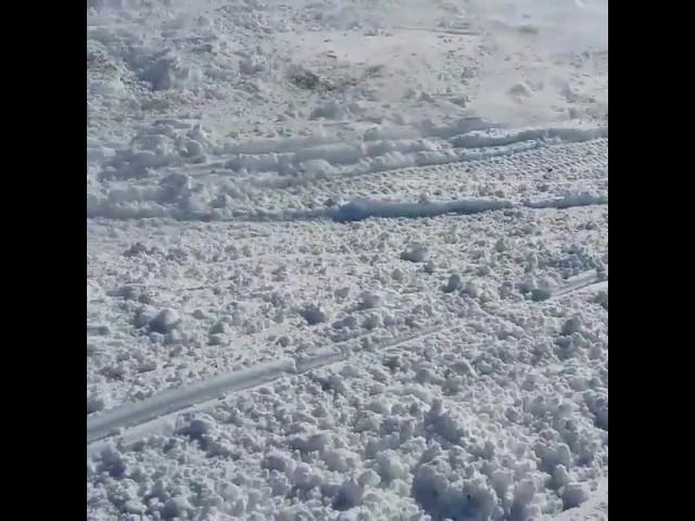 Hitting jumps on a snowmobile