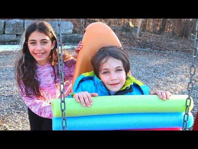 Heidi Guides Zack to Safe Play at the Outdoor Playground