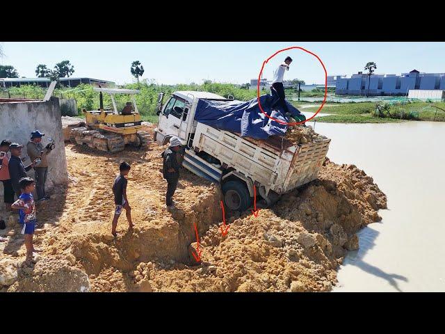 Amazingly!! 5-Ton Truck Sinks While Unloading Dirt: Komatsu D31P Dozer saves the day