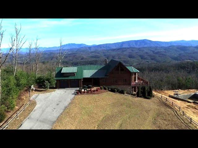 Custom log cabin in The Summit at 3065 Smoky Bluff Trl