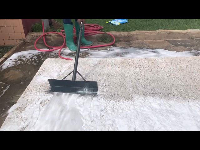 Scraping dirty water off rug. Deeply satisfying