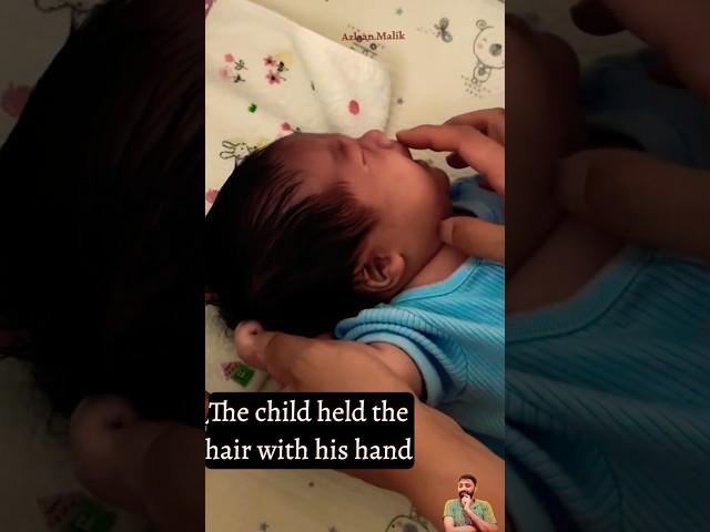 The child held the hair with his hand | The baby is crying by pulling the hair.#shorts