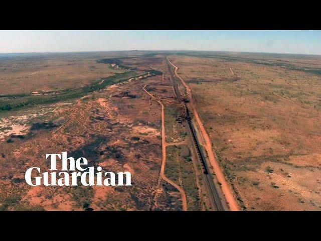 BHP train derailment: footage shows two-kilometre train crash in outback Australia