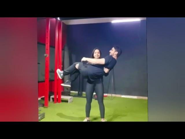 Girlfriend cradle carry her boyfriend on gym | girl friend lift carry her boy friend