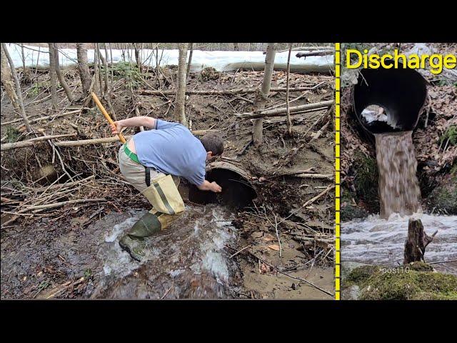 Unclogging And Sending Log Through Old Iron Culvert