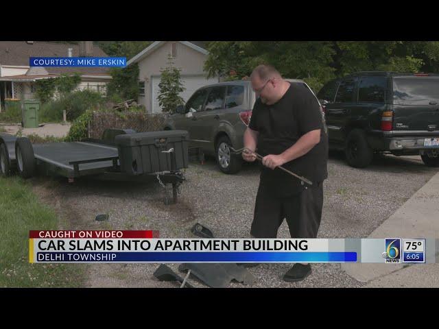 Car slams into apartment building