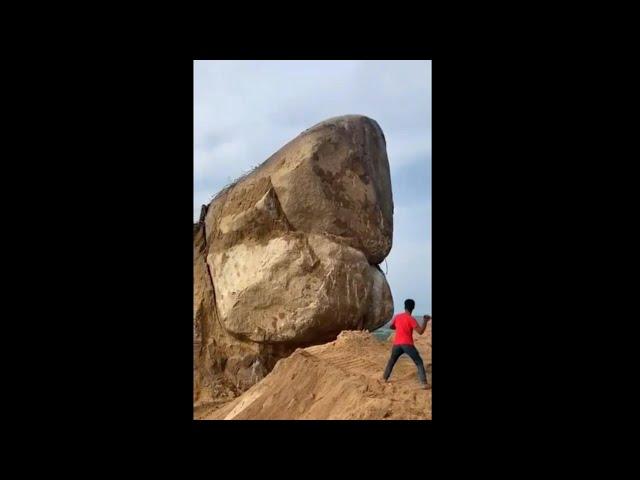 【衝撃映像】男性が巨大な岩に石を投げると周りの土が崩れて岩が… #Shorts