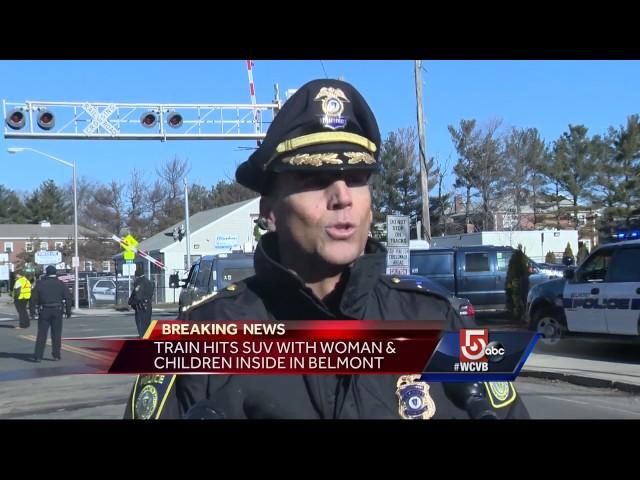 Woman injured when car struck by train