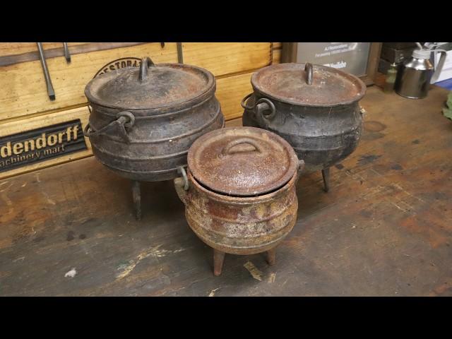 Restoring 3 rusted cast iron tripod pots and cooking in them.