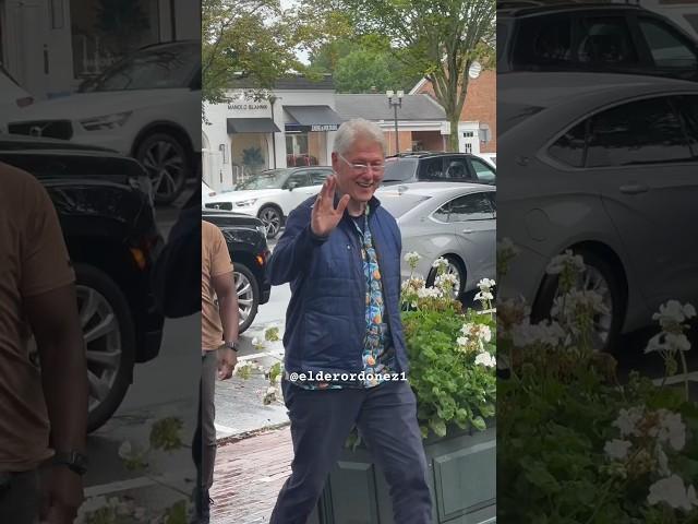 Former President Bill Clinton all smiles as he enters a bookstore in the Hamptons yesterday morning