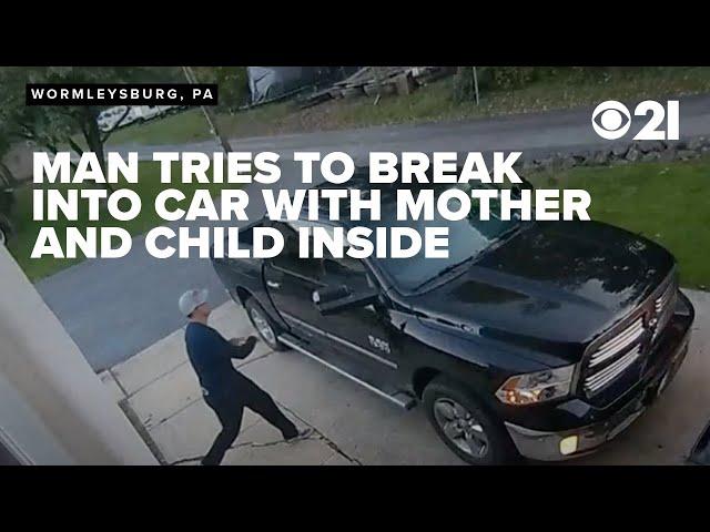 CAUGHT ON CAMERA: Man tries breaking into mother's car while she and her 6-year-old are inside