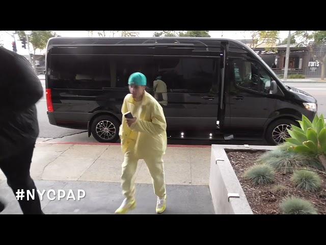 Justin Bieber in a good mood as he heads into an office building in Beverly Hills