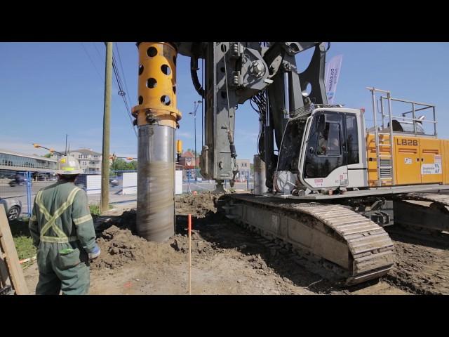 Liebherr LB 24 and LB 28 installing seacant pile wall using segmental casing