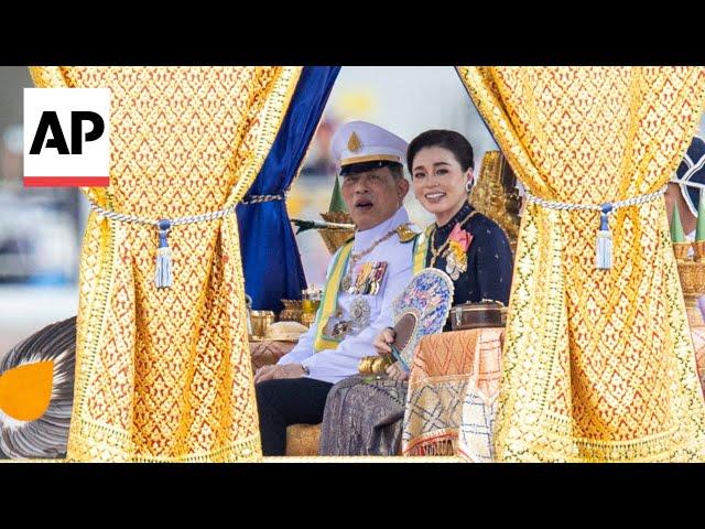 Thailand's king takes part in ancient royal barge procession in Bangkok