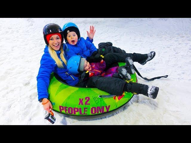 Gaby, Alex and Mom play in the snow at the Winter Play Center