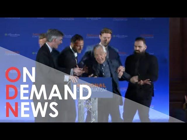 Protestor STORMS National Conservatism Conference | Breaking News