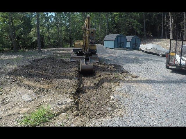 Digging a drainage trench