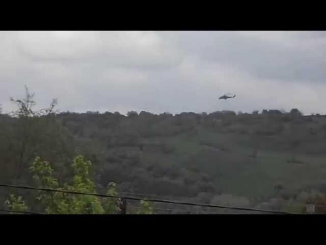 May 5 2014: Ukrainian army helicopter fires a rocket towards militia