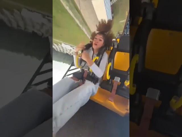 Trying to use a mobile phone on a roller coaster