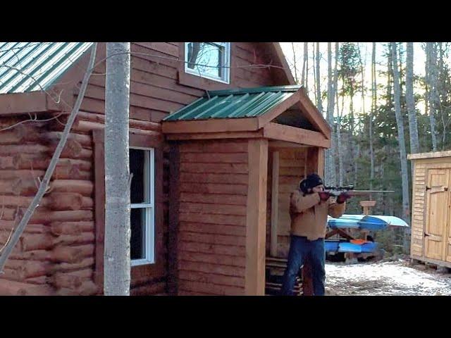 Log cabin built in the north￼.Wolf or a coyote stalked me all day in the north wilderness ￼Canadian